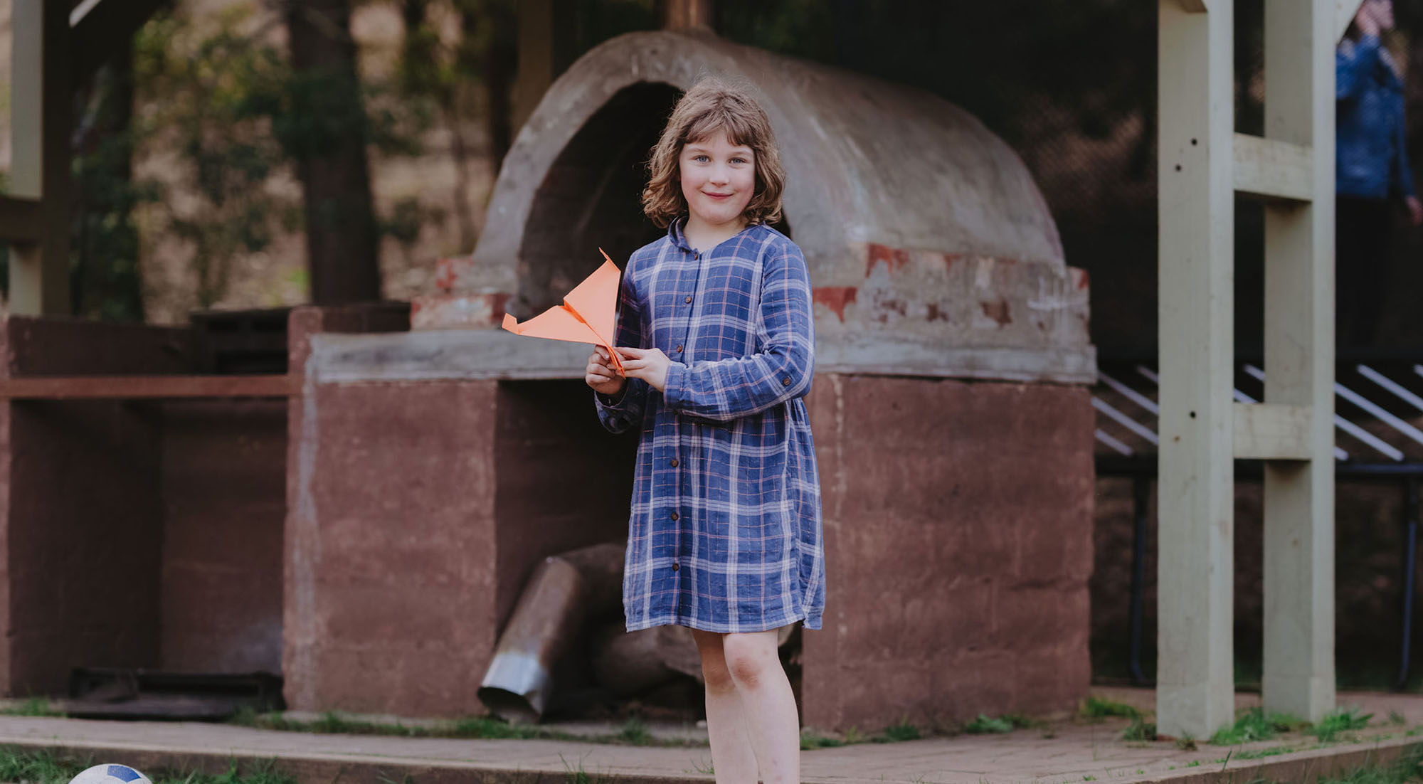 Candlebark Campus student ready to throw a paper plane